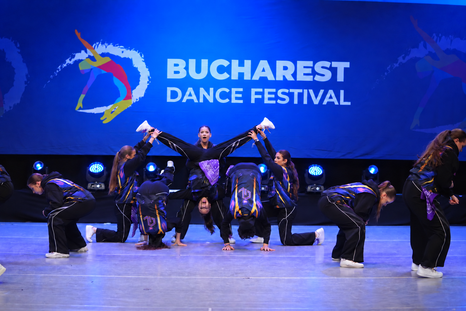 Dancers performing on stage at Bucharest Dance Festival