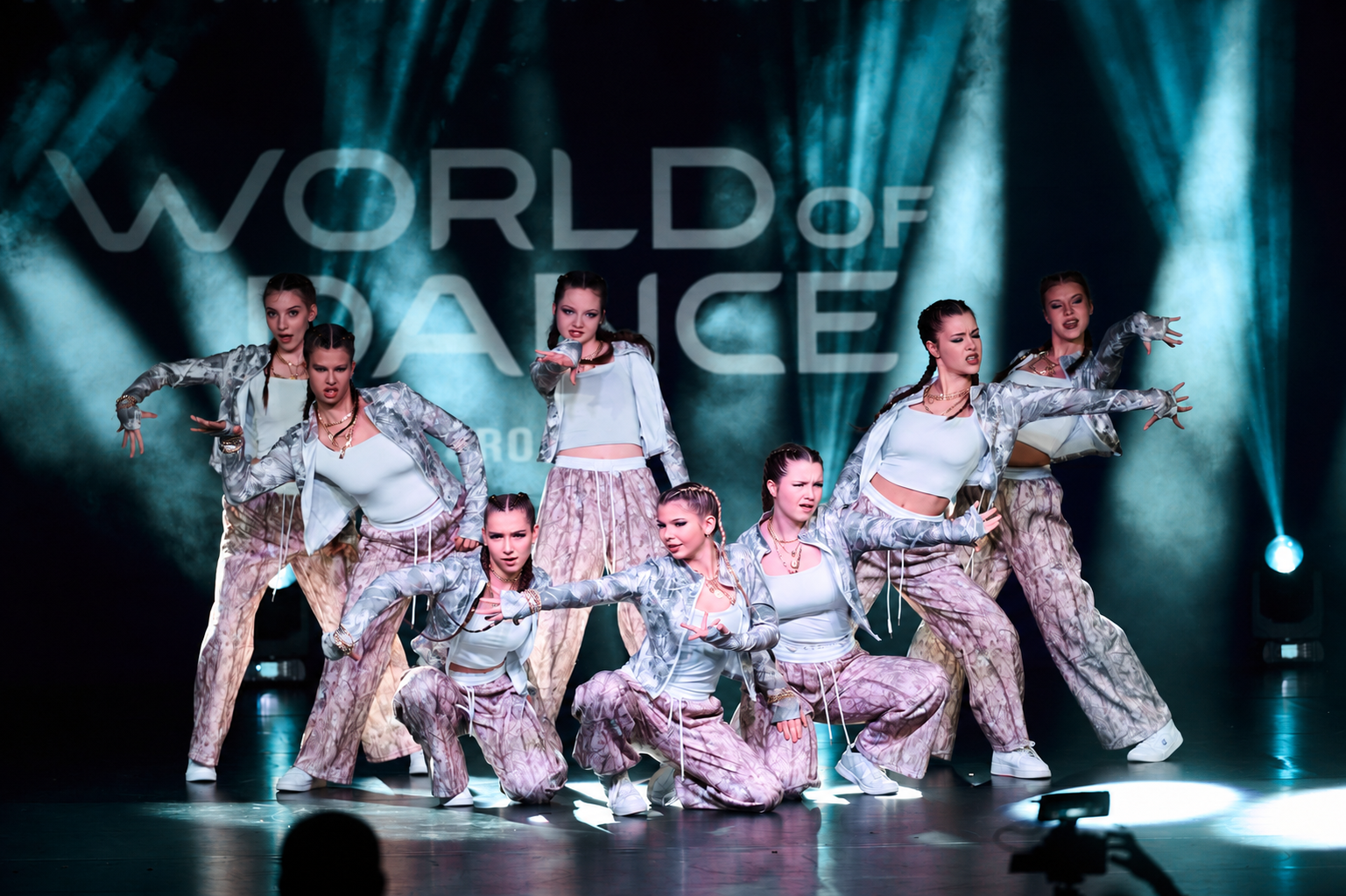Dancers performing on a World of Dance stage